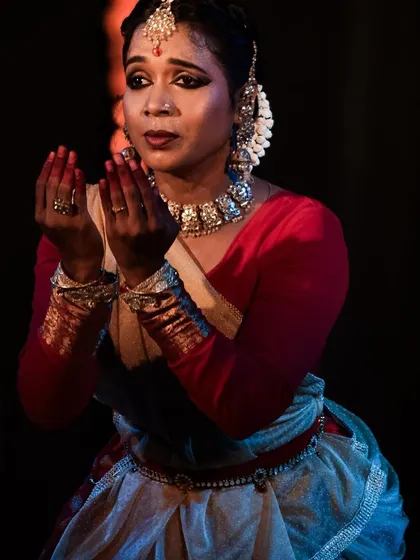 A moment of devotion and prayer within the Kathak performance.