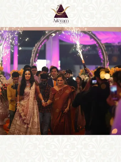 A bride's grand entrance, made even more spectacular with handheld cold pyro sparklers held by the wedding party. It creates a beautiful and photogenic pathway of light.