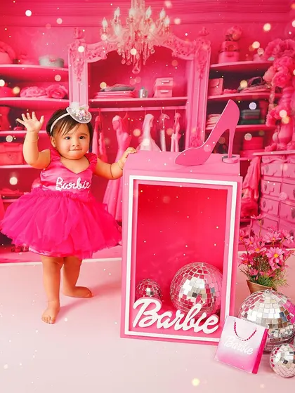 Waving hello from the Barbie dream house! This full-length shot shows off the incredible detail of the set and the birthday girl's adorable outfit.
