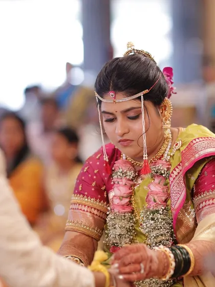 A focused moment during the ceremony. The makeup is set to last through long hours and emotional moments, ensuring she looks flawless throughout.
