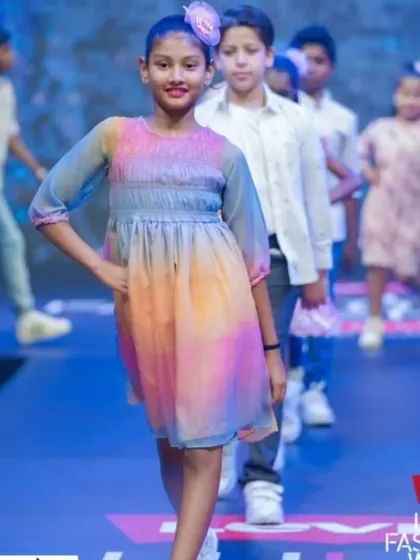 One of my students walking the ramp like a pro at the Lulu Fashion Week. Our fashion classes, led by a professional model, prepare them for real-world opportunities.