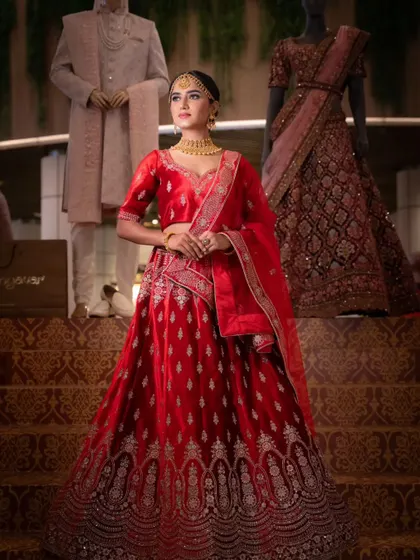 A full-length shot on the grand staircase, showing how the entire look comes together in a magnificent setting.