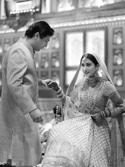 A classic black and white shot of a tender moment between the bride and groom. This timeless style strips away all distractions, focusing purely on the emotion and connection shared between them.
