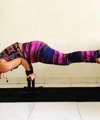 Mayurasana on my favorite parallette bars. The bars help to get a better grip and lift, making the pose more accessible while still being challenging.