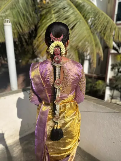 A full view of the pearl and stone 'Jadai' hairstyle, captured in beautiful natural sunlight.