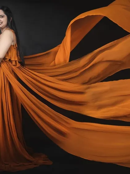 This mustard yellow gown with four flowing trails creates a stunning, ethereal effect for maternity photos. The color is warm, cheerful, and photographs beautifully.