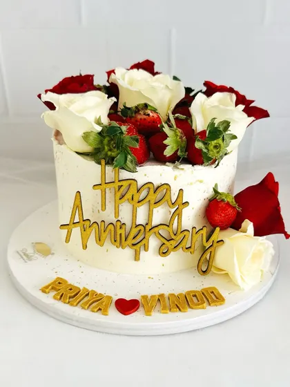 A full view of the stunning strawberry and rose anniversary cake, a perfect celebration of love.