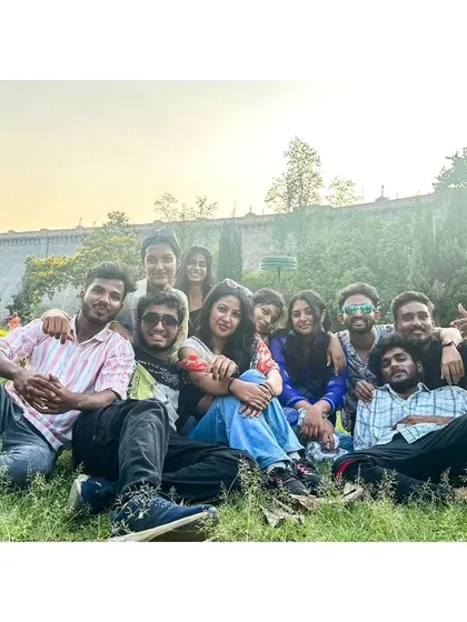 A duplicate of the group relaxing on the lawns of Brindavan Gardens at sunset. It's the perfect way to end a day of exploring Mysore.