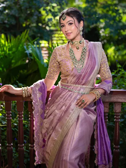 Another angle of this unique South Indian bridal look, showcasing the intricate jewelry and the flawless, dewy skin.
