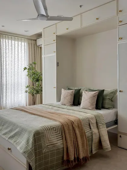 This series showcases different serene bedroom styles. From the bold red headboard with mirrored wardrobes to the calming green Murphy bed, each space is a sanctuary of calming colors and soft textures.