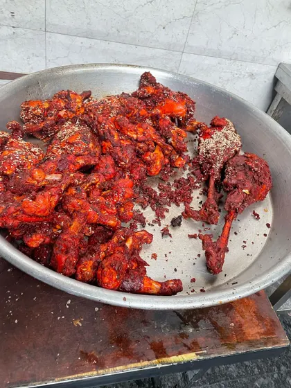 A tray of our spicy fried chicken drumsticks, a crowd-pleasing starter that's perfect for any party or event. Each piece is coated in a flavourful masala.