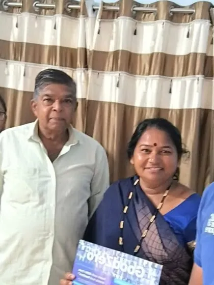 A family receives our "GoodZero" brochure from our team.