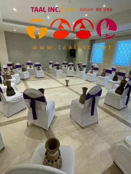 The calm before the storm. A circle of djembes ready and waiting for the participants. This setup itself creates a sense of anticipation and excitement.