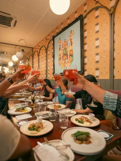 Cheers to nights you won't forget. Guests raising a glass at one of my exclusive dining events.