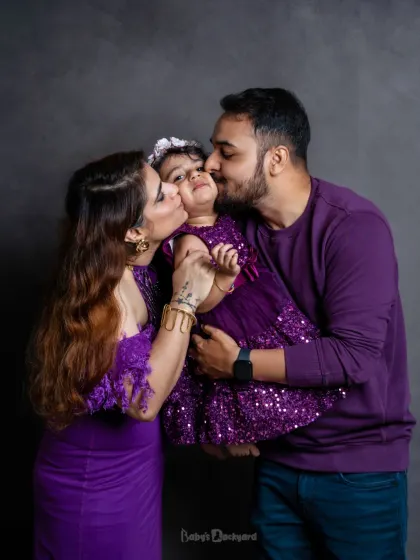 All we need is love and this little sparkle in our lives. Kisses from mom and dad make for the sweetest photos.