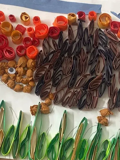 A detailed paper quilling artwork of a hedgehog created by one of our youngest artists. This activity is excellent for developing fine motor skills and patience.