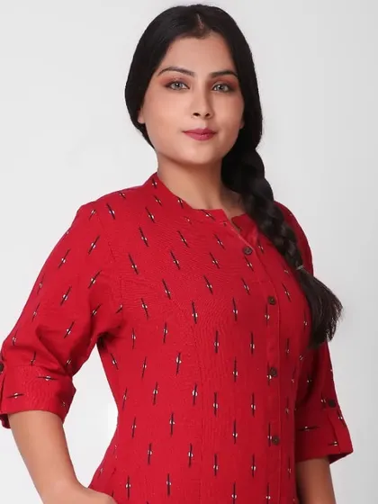 A close-up shot of an ethnic wear garment helps highlight the fabric and neckline details. This portrait of a plus-size model in a red kurti provides a clear view of the mandarin collar and print.