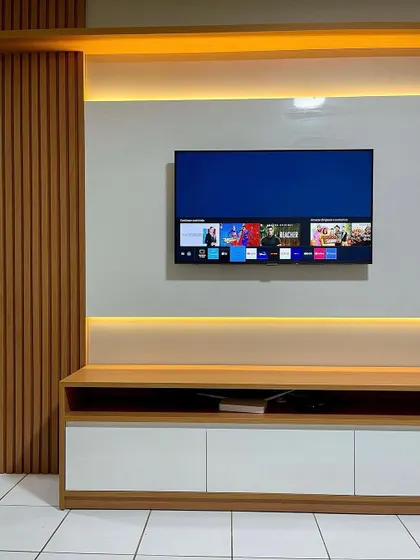 The same TV unit, showing how it looks with the television on. The design ensures that all wires are neatly concealed.