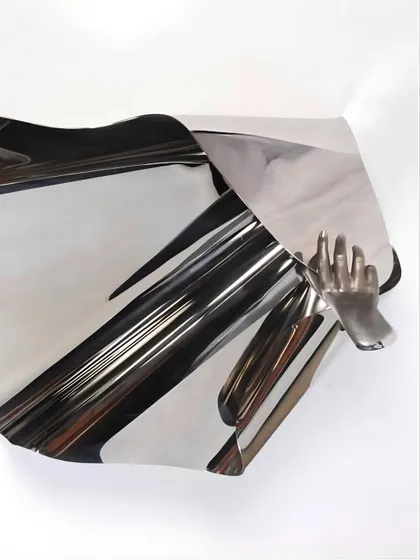 The reflective surface of "The Power of Being" creates an illusion of movement and lightness.