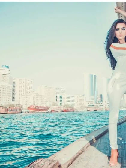 Capturing a resort wear collection on a boat in Dubai, this shot blends fashion with a lifestyle narrative. The bright, open-air setting and the model's confident pose create a feeling of luxury and freedom, ideal for a travel or summer campaign.