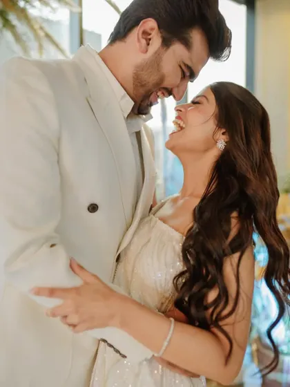 The happiest couple! Utsavi and her partner sharing a laugh. Her makeup is natural and glowing, perfect for this intimate event.