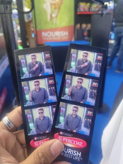 A close-up of the branded photo strips from the Supercoat activation at PetFed. The high-quality print and clear branding make this a great marketing tool and a cherished keepsake for attendees.