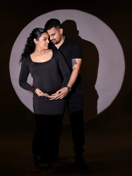 A duplicate of the beautiful spotlight couple's portrait, highlighting our skill in creative studio lighting.