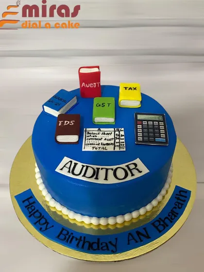 A cake for the professional who deals with numbers. This auditor-themed cake is decorated with edible books for Tax, GST, and Audit, along with a calculator and balance sheet.
