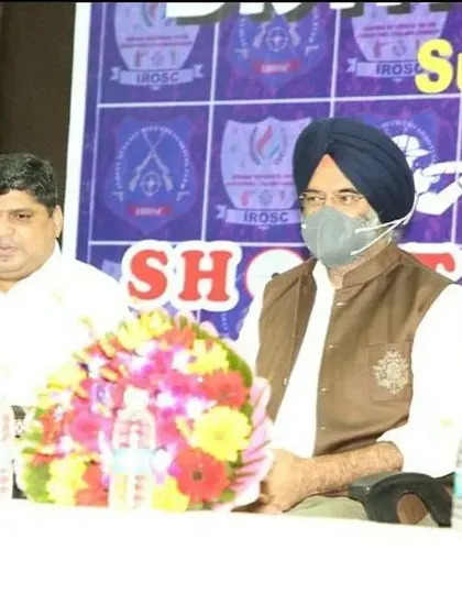 Seated with the chief guest during the prize distribution ceremony, overseeing the successful conclusion of the championship.