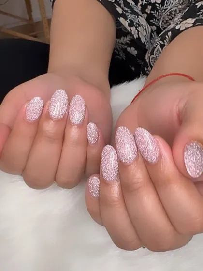 Another view of the intensely sparkly pink reflective glitter nails.