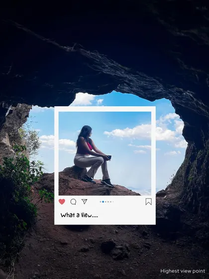 What a view! A traveler sits at the mouth of a cave, looking out at the sky. My Chikmagalur trips are about finding these secret spots with incredible views.
