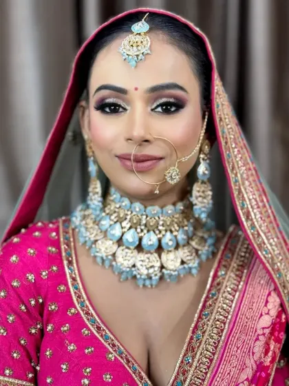 A close-up of the bold eye makeup. The contrast between the dark, smokey shadow and the bright outfit is stunning.