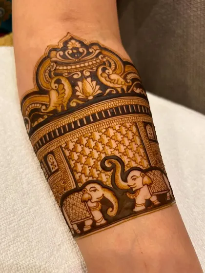 Another angle of the royal leg design, showing the beautiful cuff-like pattern with peacocks and elephants. This is a popular choice for full bridal mehndi.
