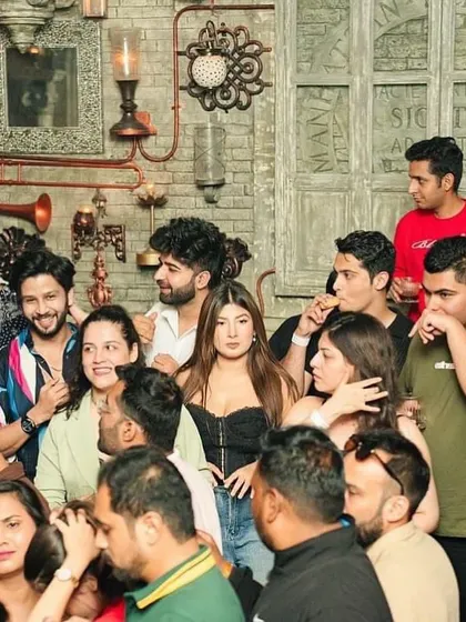 A glimpse of the stylish crowd enjoying the night. The energy of the audience is a huge part of the experience.