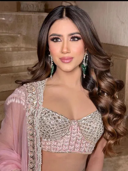 A close-up of the client, her beautiful waves and glamorous makeup creating a show-stopping look.