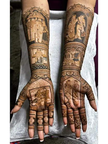 This themed bridal mehendi captures several important family and ceremony moments. Each panel on the arms tells a different part of the story, creating a rich tapestry of memories.