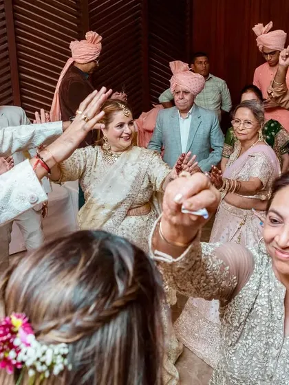 The dance floor is a mix of generations, with everyone coming together to celebrate the couple with their best moves.