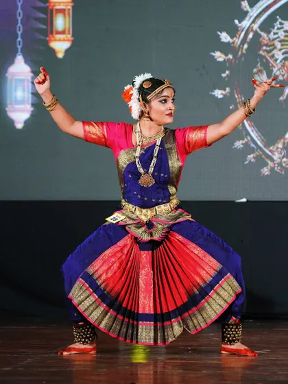 A student from the open category holding a powerful pose. Her strong and confident performance won her 1st place.