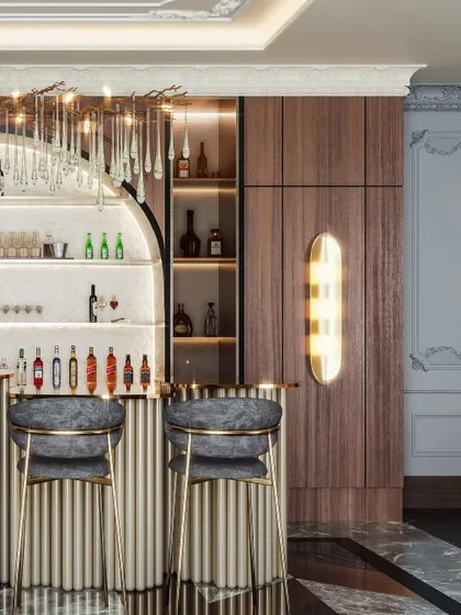 A close-up of the bar, highlighting the backlit shelving and the plush, custom bar stools.
