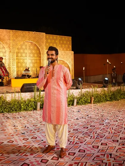 A happy, candid moment on stage in a pink kurta. My smile is my best accessory.