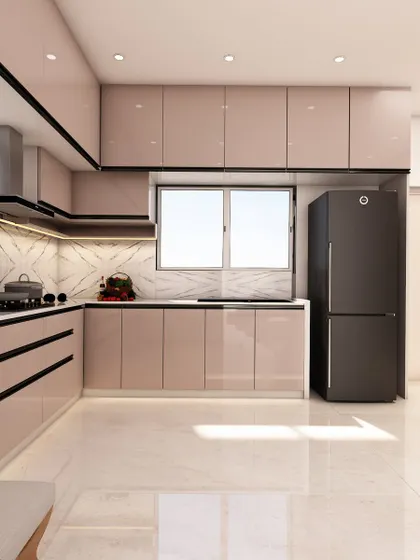 Another view of the blush-toned kitchen, highlighting the sleek black accents on the handles and appliances that provide a modern contrast.