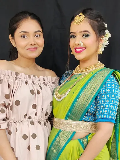 Here I am with my model after completing her Maharashtrian bridal makeup. It's always a proud moment to see the final look come together.