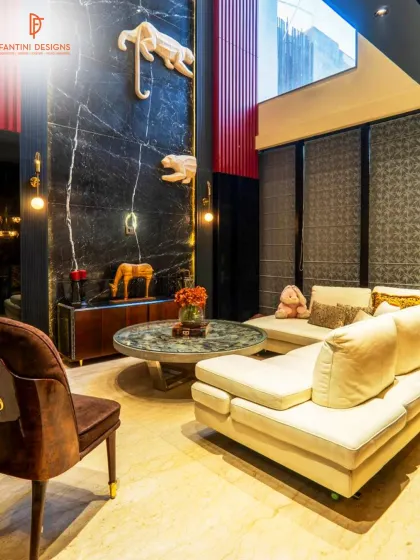 Here you can see the double-height wall with the climbing tiger sculptures, which adds a playful yet powerful element to this living room. It’s a great example of how I integrate custom art into my designs.