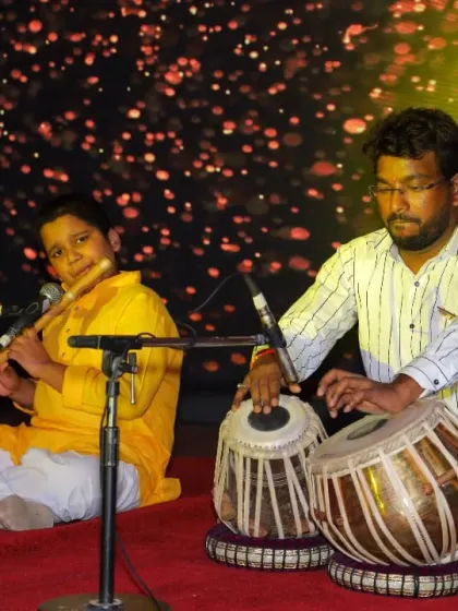 A wider view of the flute and tabla jugalbandi performance. Our stage setups are professional, with proper acoustics and lighting to give students an authentic artist experience.