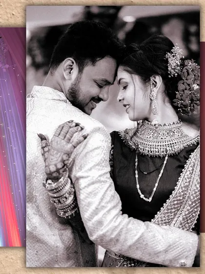 A timeless black and white portrait of the couple. Their classic dance pose and the intricate details of their outfits are beautifully captured in this monochrome shot.