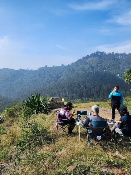 A picnic with a valley view in Yercaud. We believe in rewarding your effort with delicious food in spectacular locations, a signature part of our curated experiences.