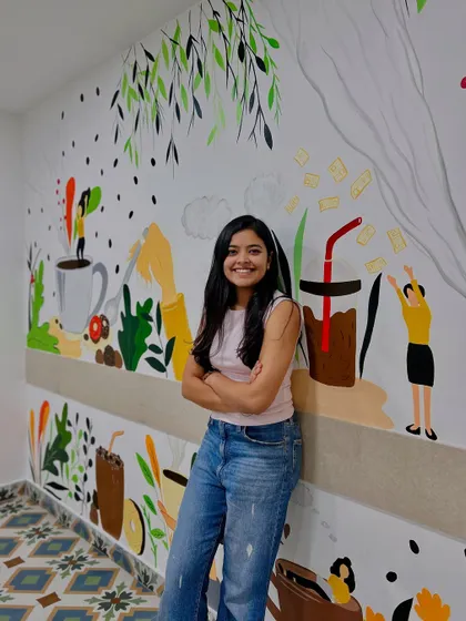 Posing with the completed second mural. I love how it turned a simple cafe space into a whole vibe.