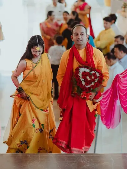 The couple making their entrance for the Haldi ceremony, ready for the festivities.