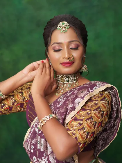 A serene shot with eyes closed, highlighting the eyeshadow and glowing skin.