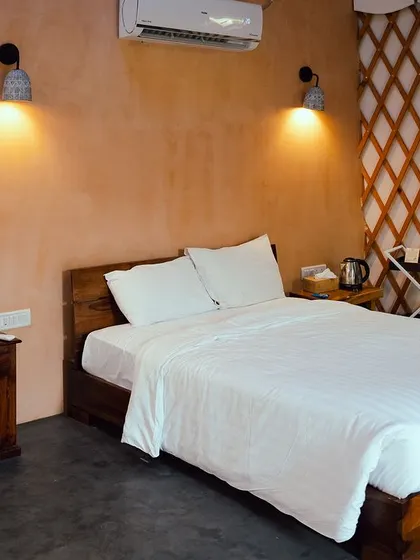 A closer look inside our cozy yurt cottage, showcasing the comfortable bed and rustic-chic decor.